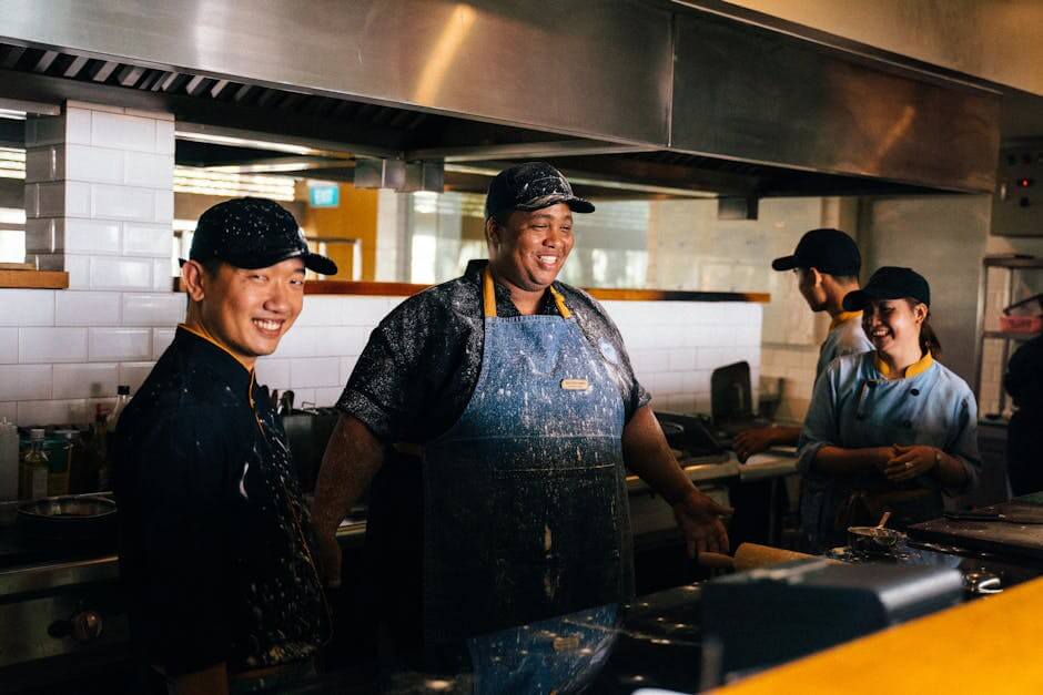 Chefs working together in a busy NYC restaurant kitchen.