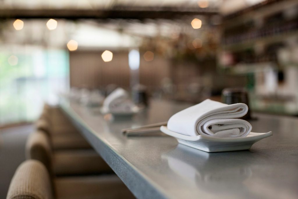 Folded white cloth on a restaurant counter