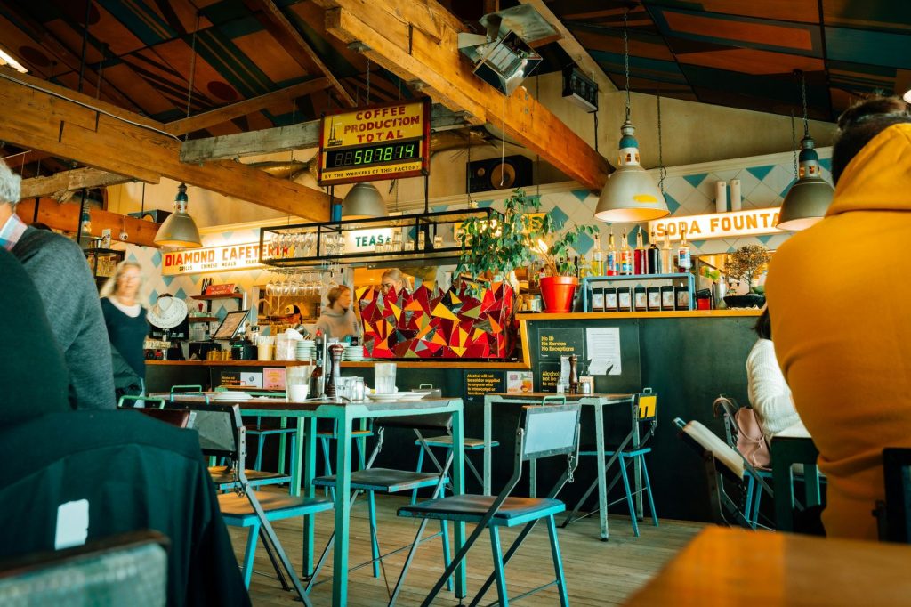 Interior of a busy restaurant with patrons at tables