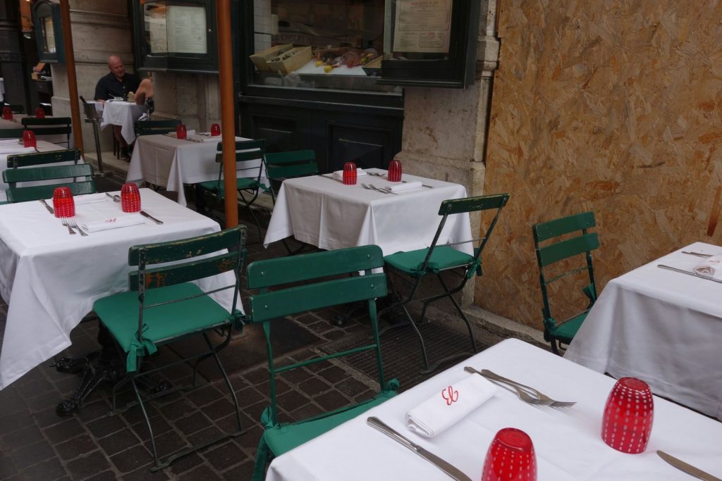 Restaurant tables set with crisp white tablecloths